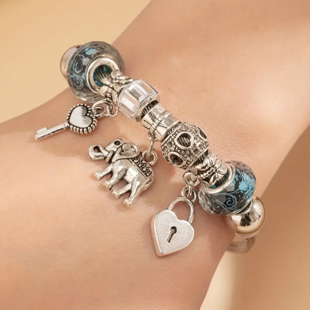 Silver Charm Bracelet with Blue Accents. New.